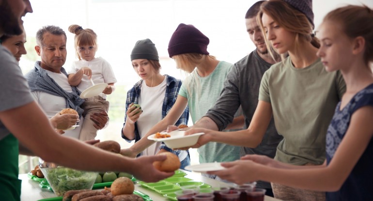 Unrealistically clean soup kitchen full of models